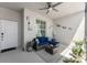 Screened in porch with outdoor seating, rug, ceiling fan, and decorations at 14281 Heritage Landing Blvd # 1411, Punta Gorda, FL 33955