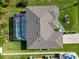 A high angle shot shows the roof and pool at 1508 Westover St, Port Charlotte, FL 33953