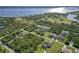 Scenic aerial view showcasing waterfront homes nestled amidst lush greenery and tranquil waters at 1508 Westover St, Port Charlotte, FL 33953