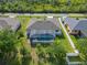 Backyard aerial view featuring a private pool and a well-maintained lawn at 1508 Westover St, Port Charlotte, FL 33953