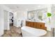 Luxurious bathroom featuring a standalone tub, dual vanities and an abundance of space at 1508 Westover St, Port Charlotte, FL 33953