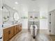 Spa-like bathroom featuring a free-standing tub, double sinks, and modern fixtures at 1508 Westover St, Port Charlotte, FL 33953