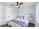 Bedroom featuring a ceiling fan, natural light, and a comfortable bed with stylish linens at 1508 Westover St, Port Charlotte, FL 33953