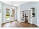 Inviting entryway with wood-look floors and views to the game room and backyard at 1508 Westover St, Port Charlotte, FL 33953