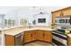 Modern kitchen boasts an open layout, countertops, stainless steel appliances, and ample counter space at 1508 Westover St, Port Charlotte, FL 33953