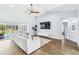 Bright living room boasts vaulted ceilings, sleek floors, and an open layout to the outdoor pool area at 1508 Westover St, Port Charlotte, FL 33953