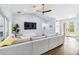 Bright living area offering modern decor, ceiling fan, and a seamless transition to outdoor spaces at 1508 Westover St, Port Charlotte, FL 33953