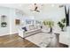Bright, airy living room with a sectional sofa and wood floors at 1508 Westover St, Port Charlotte, FL 33953