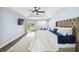 Bright bedroom with access to the lanai, featuring a tray ceiling and a ceiling fan at 1508 Westover St, Port Charlotte, FL 33953