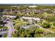Aerial view of community featuring lush landscaping and pond views. Buildings are well maintained at 1515 Forrest Nelson Blvd # L204, Port Charlotte, FL 33952
