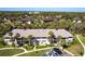 Community aerial view showcasing the building and beautiful landscaping at 1515 Forrest Nelson Blvd # L204, Port Charlotte, FL 33952