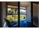 Relaxing balcony view with seating, blue carpet, and outdoor scenery at 1515 Forrest Nelson Blvd # L204, Port Charlotte, FL 33952