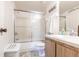 Functional bathroom with sliding shower doors, a neutral color scheme, and vanity at 1515 Forrest Nelson Blvd # L204, Port Charlotte, FL 33952
