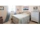 Charming bedroom with coastal decor, a dresser, and a bright window with sheer curtains at 1515 Forrest Nelson Blvd # L204, Port Charlotte, FL 33952