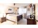 Cozy bedroom featuring a wooden bed frame, soft lighting, and decorative wall art at 1515 Forrest Nelson Blvd # L204, Port Charlotte, FL 33952