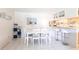Bright dining room with tile floor and white dining set at 1515 Forrest Nelson Blvd # L204, Port Charlotte, FL 33952