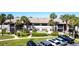 Condominium with palm trees, landscaped yard, and ample parking spaces at 1515 Forrest Nelson Blvd # L204, Port Charlotte, FL 33952