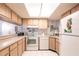 Eat-in kitchen with sleek white appliances and abundant cabinet space at 1515 Forrest Nelson Blvd # L204, Port Charlotte, FL 33952