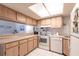 Well-maintained kitchen with bright lighting and white appliances at 1515 Forrest Nelson Blvd # L204, Port Charlotte, FL 33952