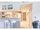Open concept kitchen and hall with white countertops and updated appliances at 1515 Forrest Nelson Blvd # L204, Port Charlotte, FL 33952