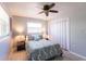 Serene bedroom with a ceiling fan, closet, and side tables with lamps for a cozy, inviting feel at 1516 Saint Clair Rd, Englewood, FL 34223