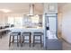 Stylish kitchen featuring a breakfast bar, modern appliances, and ample counter space for meal preparation at 1516 Saint Clair Rd, Englewood, FL 34223
