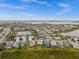 Aerial view of a beautiful neighborhood with ponds, landscaping, and modern homes at 16240 Palmetto St, Punta Gorda, FL 33982