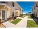 Well-maintained exterior with tidy landscaping, walkway leading towards a shared pool area, and a charming entrance at 17200 Acapulco Rd # 123, Punta Gorda, FL 33955