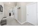 Neutral hallway with a bench leading towards the kitchen at 17200 Acapulco Rd # 123, Punta Gorda, FL 33955