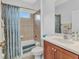 Inviting bathroom featuring a shower-tub combo, stylish curtain, and neutral tones for a clean aesthetic at 1808 Kings Gate Ct, Punta Gorda, FL 33980