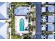 Aerial view of a community pool, clubhouse and condos with lush landscaping and private parking at 2002 Bal Harbor Blvd # 1022, Punta Gorda, FL 33950