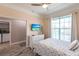 Bright bedroom with TV, nautical decorations, and outdoor views at 2002 Bal Harbor Blvd # 1022, Punta Gorda, FL 33950