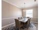 Elegant dining room with a modern chandelier, a beautiful rug, and a cozy atmosphere at 2002 Bal Harbor Blvd # 1022, Punta Gorda, FL 33950