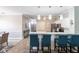 Open-concept kitchen with bar seating, white cabinets, and modern appliances perfect for entertaining at 2002 Bal Harbor Blvd # 1022, Punta Gorda, FL 33950