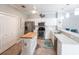 Well-lit kitchen featuring an island, stainless steel appliances, and ample cabinet space for storage at 2002 Bal Harbor Blvd # 1022, Punta Gorda, FL 33950
