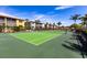 Well-maintained community tennis court with lush landscaping and bright blue sky, ideal for recreation at 2002 Bal Harbor Blvd # 1022, Punta Gorda, FL 33950