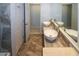 Bathroom featuring a double sink vanity with marble countertops and tile flooring at 22191 New Rochelle Ave, Port Charlotte, FL 33952
