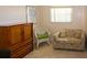 Cozy bedroom with tile flooring, a window, and comfortable furnishings at 22191 New Rochelle Ave, Port Charlotte, FL 33952