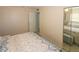 Bedroom featuring tiled floors, closet with mirrored doors, and a neutral color scheme at 22191 New Rochelle Ave, Port Charlotte, FL 33952