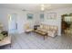 Open concept living area with tile flooring and a view into the bathroom at 22191 New Rochelle Ave, Port Charlotte, FL 33952