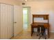 Office space featuring tile flooring, a closet, and a wooden desk with chair at 22191 New Rochelle Ave, Port Charlotte, FL 33952