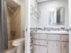 Bathroom featuring a vanity with drawers, sink, mirror, and a shower behind a curtain at 23179 Maclellan Ave, Port Charlotte, FL 33980