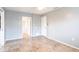 Bedroom with light gray walls, tile flooring, and multiple doorways at 23179 Maclellan Ave, Port Charlotte, FL 33980