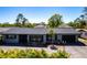 Charming single-story home with a well-manicured lawn and attached two-car garage at 23179 Maclellan Ave, Port Charlotte, FL 33980