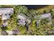 Aerial view of the community highlights lush greenery, water features, and an expansive layout at 238 Southampton Dr # 319, Venice, FL 34293