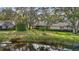 Lush backyard with mature landscaping and a peaceful waterway offers a tranquil and private outdoor space at 238 Southampton Dr # 319, Venice, FL 34293