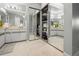 Bright bathroom features dual sinks, vanities, mirrored closets and tiled floors at 238 Southampton Dr # 319, Venice, FL 34293