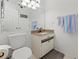 Bathroom features a vanity with granite countertop, and decorative towels, and a mirrored wall at 238 Southampton Dr # 319, Venice, FL 34293