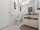 Well-lit bathroom with a vanity, toilet, and neutral decor, offering a clean and functional space at 238 Southampton Dr # 319, Venice, FL 34293