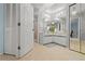 Spacious bathroom features dual sinks, vanity, and a walk-in shower with a tiled floor at 238 Southampton Dr # 319, Venice, FL 34293
